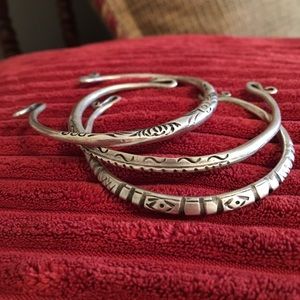 Sterling silver cuff bracelets.